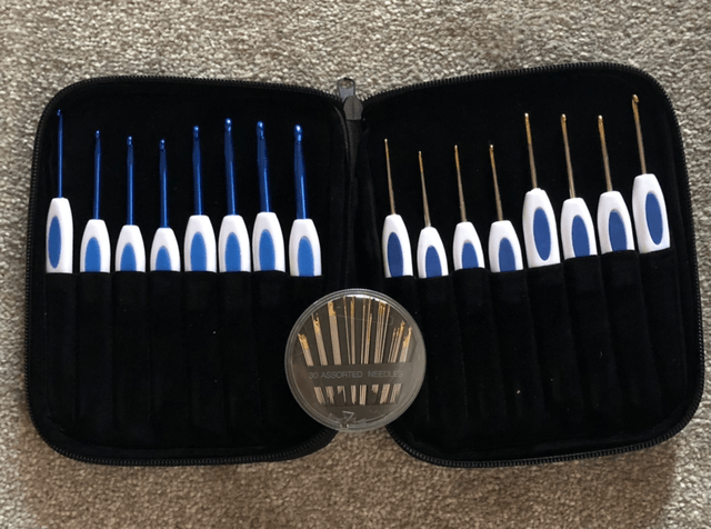 Crochet Hook set and a packet of sewing needles