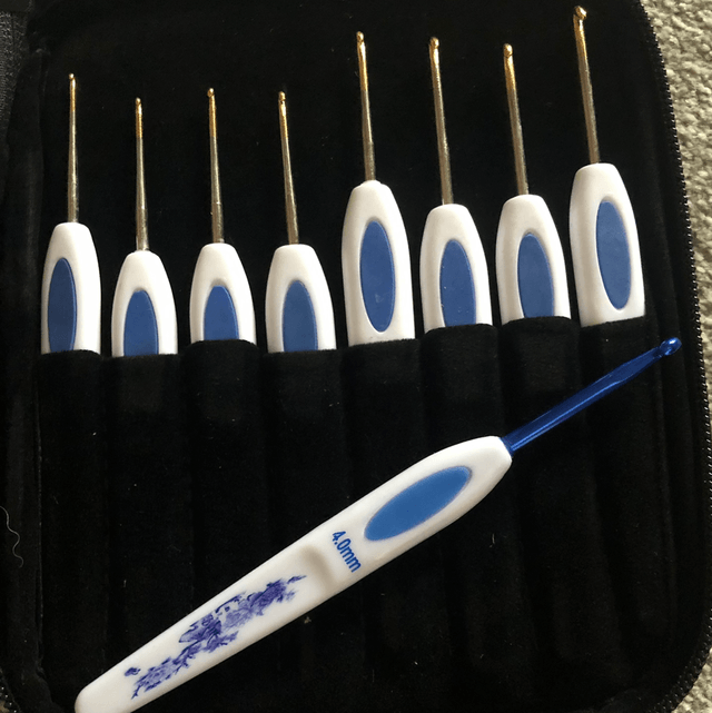 Crochet Hook set and a packet of sewing needles