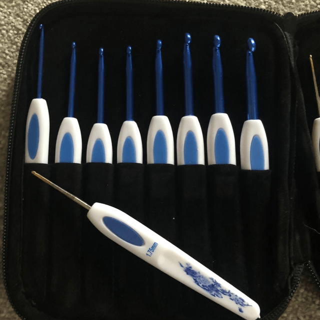 Crochet Hook set and a packet of sewing needles